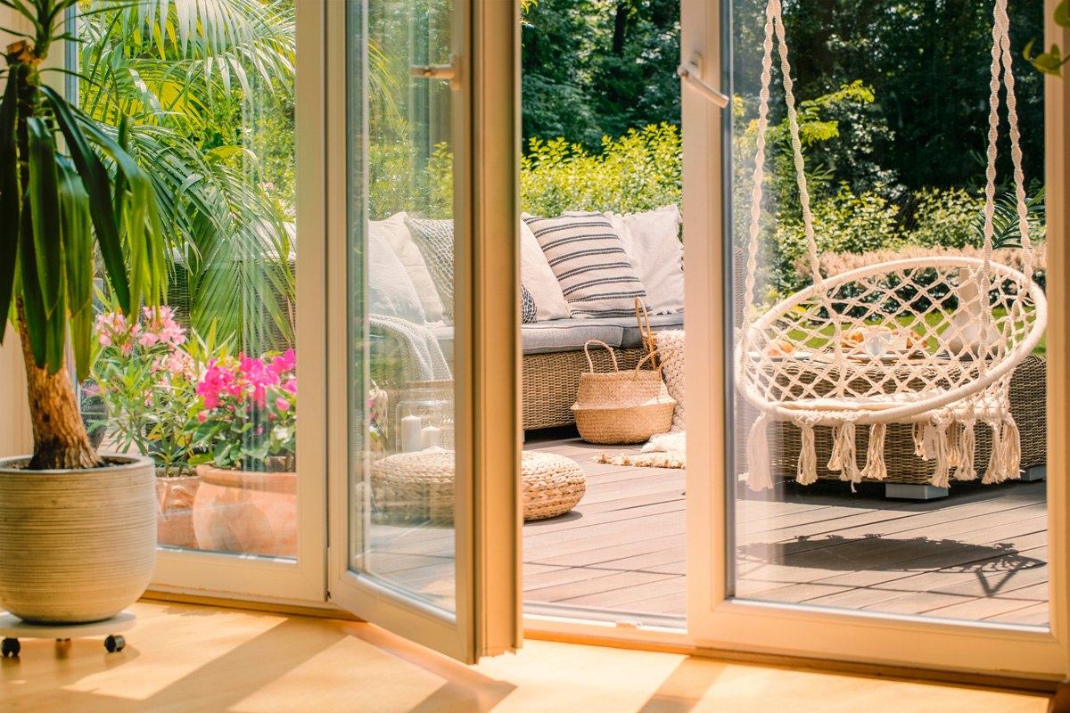 Glass patio doors leading onto a deck in El Paso.